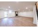 Finished basement features wood floors, walkout door, fireplace, and recessed lighting at 5548 Martina Way, Atlanta, GA 30338