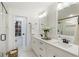 Elegant bathroom featuring double vanity, glass shower with marble tile, and stylish modern fixtures at 5548 Martina Way, Atlanta, GA 30338