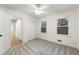 Well-lit bedroom with soft carpet, two windows, and view of the outdoors at 5548 Martina Way, Atlanta, GA 30338