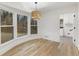 Bright dining area with a modern chandelier and large windows overlooking a backyard at 5548 Martina Way, Atlanta, GA 30338