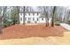 Charming renovated two-story home with a landscaped front yard and freshly painted white brick exterior at 5548 Martina Way, Atlanta, GA 30338