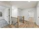 Hallway with an updated railing and lots of natural light at 5548 Martina Way, Atlanta, GA 30338