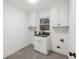 Convenient laundry room with sleek finishes and ample storage at 5548 Martina Way, Atlanta, GA 30338
