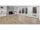 Bright living room featuring a fireplace, hardwood floors, and a bay window at 5548 Martina Way, Atlanta, GA 30338