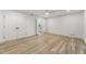 A spacious main bedroom featuring wood floors and large closet doors leading to main bath at 5548 Martina Way, Atlanta, GA 30338