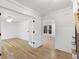 Spacious home office featuring hardwood floors, white trim, and natural light through French doors at 5548 Martina Way, Atlanta, GA 30338