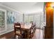 Dining room featuring hardwood floors, a large table, and bright windows at 295 Bruton Way, Atlanta, GA 30342