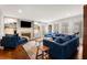 Spacious living room with built-in shelving, a fireplace, and lots of natural light at 295 Bruton Way, Atlanta, GA 30342