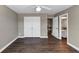 This bedroom features hardwood floors, closet, and an open door to the bathroom at 601 Wyndham Ct, Canton, GA 30115