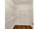 A walk-in closet with ample shelving at 601 Wyndham Ct, Canton, GA 30115