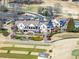 Aerial view of a golf clubhouse with a lawn and manicured landscape at 601 Wyndham Ct, Canton, GA 30115