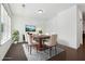 Staged dining room featuring modern furniture and natural light at 4685 Dewitt Dr, Duluth, GA 30097