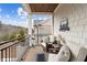 Relaxing balcony setting with outdoor seating overlooking the surrounding landscape at 569 Stone Field Nw Run, Marietta, GA 30060