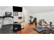 Bright upper level bonus room complete with gym equipment, an office, and a nearby tv at 569 Stone Field Nw Run, Marietta, GA 30060