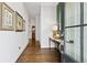 Inviting entryway with dark wood floors, elegant console table, and decorative artwork at 569 Stone Field Nw Run, Marietta, GA 30060
