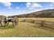 Scenic shot of historical field with fence and antique cannon in grassy pasture at 569 Stone Field Nw Run, Marietta, GA 30060