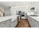 Well-appointed kitchen with stainless appliances, large island with a farmhouse sink, and ample counter space at 569 Stone Field Nw Run, Marietta, GA 30060