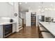 Kitchen features hardwood floors, large island with seating, stainless steel appliances, walk-in pantry and wine fridge at 569 Stone Field Nw Run, Marietta, GA 30060