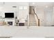 Bright kitchen view to living room with fireplace, tv, and hardwood floors at 569 Stone Field Nw Run, Marietta, GA 30060