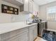 Functional laundry room with modern washer and dryer at 569 Stone Field Nw Run, Marietta, GA 30060