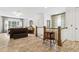 Upstairs living room features a decorative railing, contemporary furnishings, and abundant natural light at 569 Stone Field Nw Run, Marietta, GA 30060