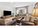 Cozy living room with a comfortable sofa and natural light at 569 Stone Field Nw Run, Marietta, GA 30060