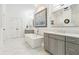 Elegant bathroom featuring a modern tub, gray cabinetry, and stylish finishes at 569 Stone Field Nw Run, Marietta, GA 30060