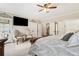Bright bedroom featuring a TV, furniture and access to balcony at 569 Stone Field Nw Run, Marietta, GA 30060