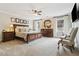 Spacious main bedroom with ceiling fan, carpet floors and elegant furniture at 569 Stone Field Nw Run, Marietta, GA 30060
