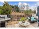 Cozy patio featuring an outdoor seating area, barbecue grill and natural landscaping at 569 Stone Field Nw Run, Marietta, GA 30060