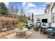 Outdoor patio with comfortable seating, landscaped garden, and fenced in privacy at 569 Stone Field Nw Run, Marietta, GA 30060