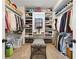 Spacious walk-in closet with built-in shelving and ample storage at 569 Stone Field Nw Run, Marietta, GA 30060