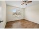 Simple bedroom featuring hardwood floors, natural light, and ceiling fan at 1100 Bradford Park Dr, Auburn, GA 30011