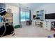 Bright bedroom with vaulted ceiling, window, bookshelf, desk, and exercise equipment at 3831 Austin Park Ln, Decatur, GA 30032