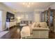 Comfortable living room with hardwood floors, large sectional, and stylish decor at 3831 Austin Park Ln, Decatur, GA 30032