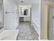 Large bathroom with double sinks, a soaking tub, a separate shower, and ample storage space at 730 Taylor School Dr, Lawrenceville, GA 30043