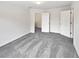 Spacious bedroom with plush carpeting, neutral walls, and ample natural light streaming through the windows at 730 Taylor School Dr, Lawrenceville, GA 30043
