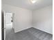 Bedroom featuring a large window and neutral-colored carpeting at 730 Taylor School Dr, Lawrenceville, GA 30043