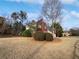 Two-story home with combination brick and siding exterior and a well-manicured front yard at 730 Taylor School Dr, Lawrenceville, GA 30043