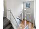Bright foyer boasts hardwood floors, a modern light fixture and a staircase at 730 Taylor School Dr, Lawrenceville, GA 30043