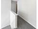 Upstairs hallway with neutral carpet and white trim leading to a bedroom at 730 Taylor School Dr, Lawrenceville, GA 30043