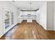 Bright kitchen with white cabinets, island, and hardwood floors at 730 Taylor School Dr, Lawrenceville, GA 30043