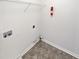 Laundry room with washer hookups and shelving at 730 Taylor School Dr, Lawrenceville, GA 30043
