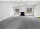Spacious living room featuring large windows and fireplace at 730 Taylor School Dr, Lawrenceville, GA 30043