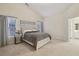 Spacious bedroom with vaulted ceilings, plush carpet, and serene decor at 1135 Chandler Ridge Dr, Lawrenceville, GA 30045