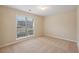 This spacious bedroom features a large window that allows ample natural light to flow in at 1135 Chandler Ridge Dr, Lawrenceville, GA 30045