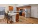 Charming kitchen features wooden cabinets, granite countertops, and stainless steel appliances at 1135 Chandler Ridge Dr, Lawrenceville, GA 30045