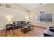 Inviting living room with hardwood floors, a comfortable sofa, and natural light, creating a serene atmosphere at 1135 Chandler Ridge Dr, Lawrenceville, GA 30045