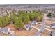 An aerial view of homes in a rural area surrounded by trees and a quiet street at 171 W Fork Way, Temple, GA 30179