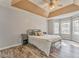 Spacious bedroom with tray ceiling, ceiling fan, wood flooring, and lots of natural light at 171 W Fork Way, Temple, GA 30179